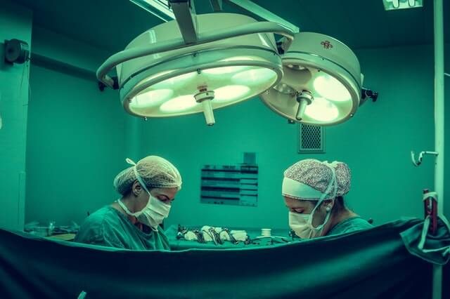 two-person-doing-surgery-inside-room-1250655-1688677